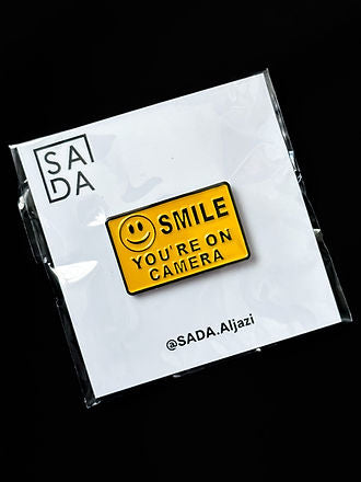 SADA Pin-smile on your camera